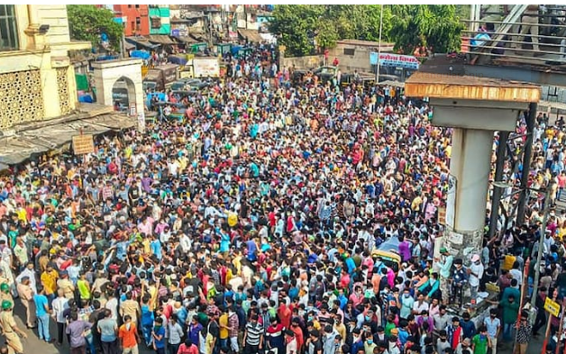 An image of migrant labors at bandra west ralway station, sunni masjid , mumbai on april,14,2020 (cortsy pti)